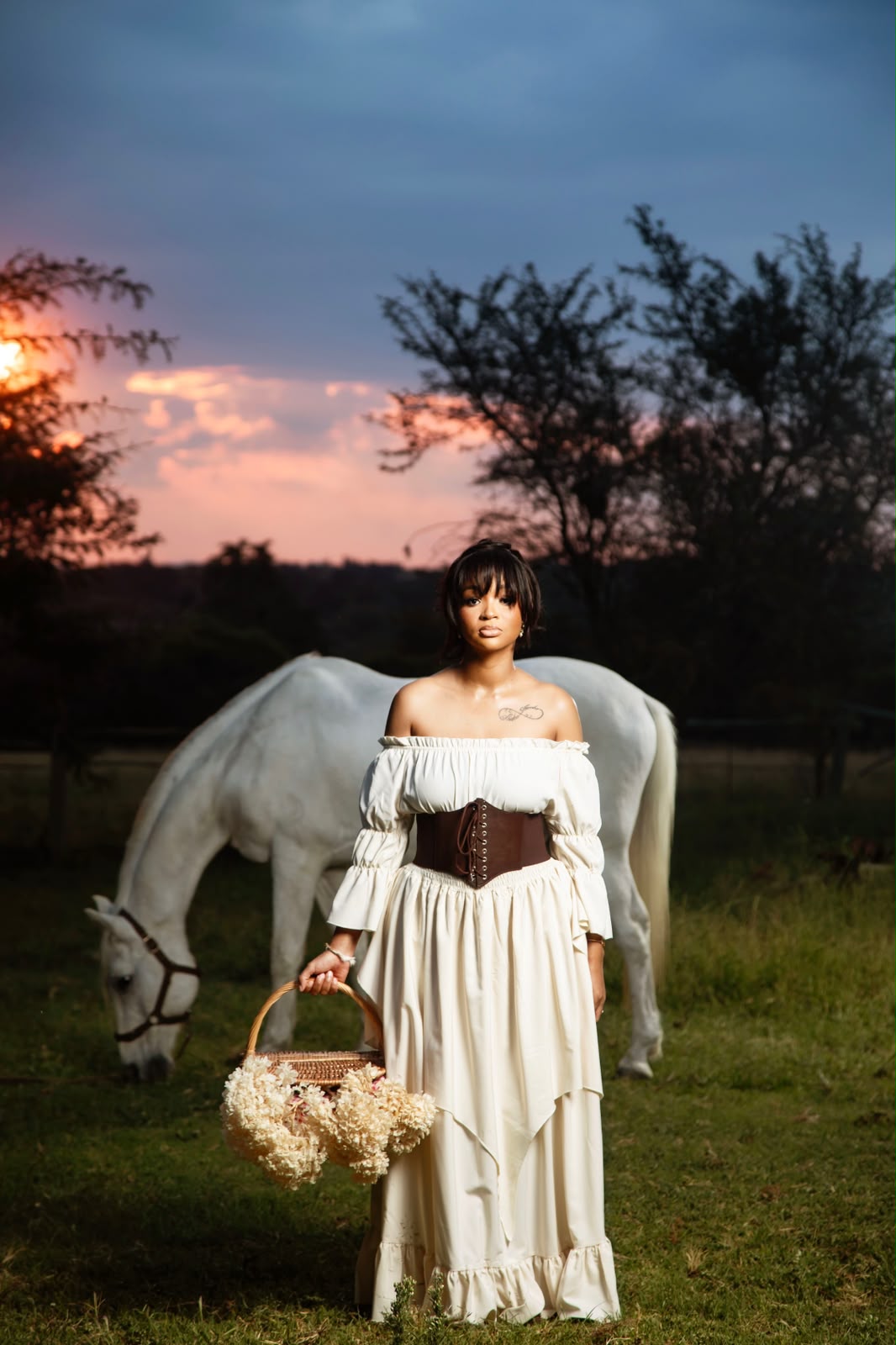 Sunset portrait with a white horse