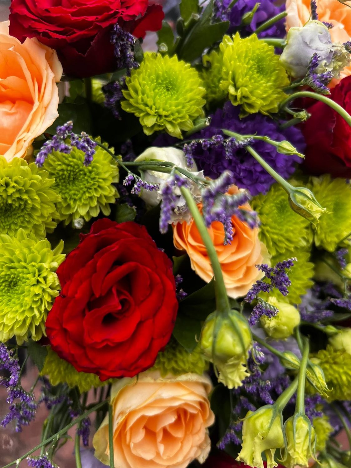 Close detail of garden roses and chrysanthemums