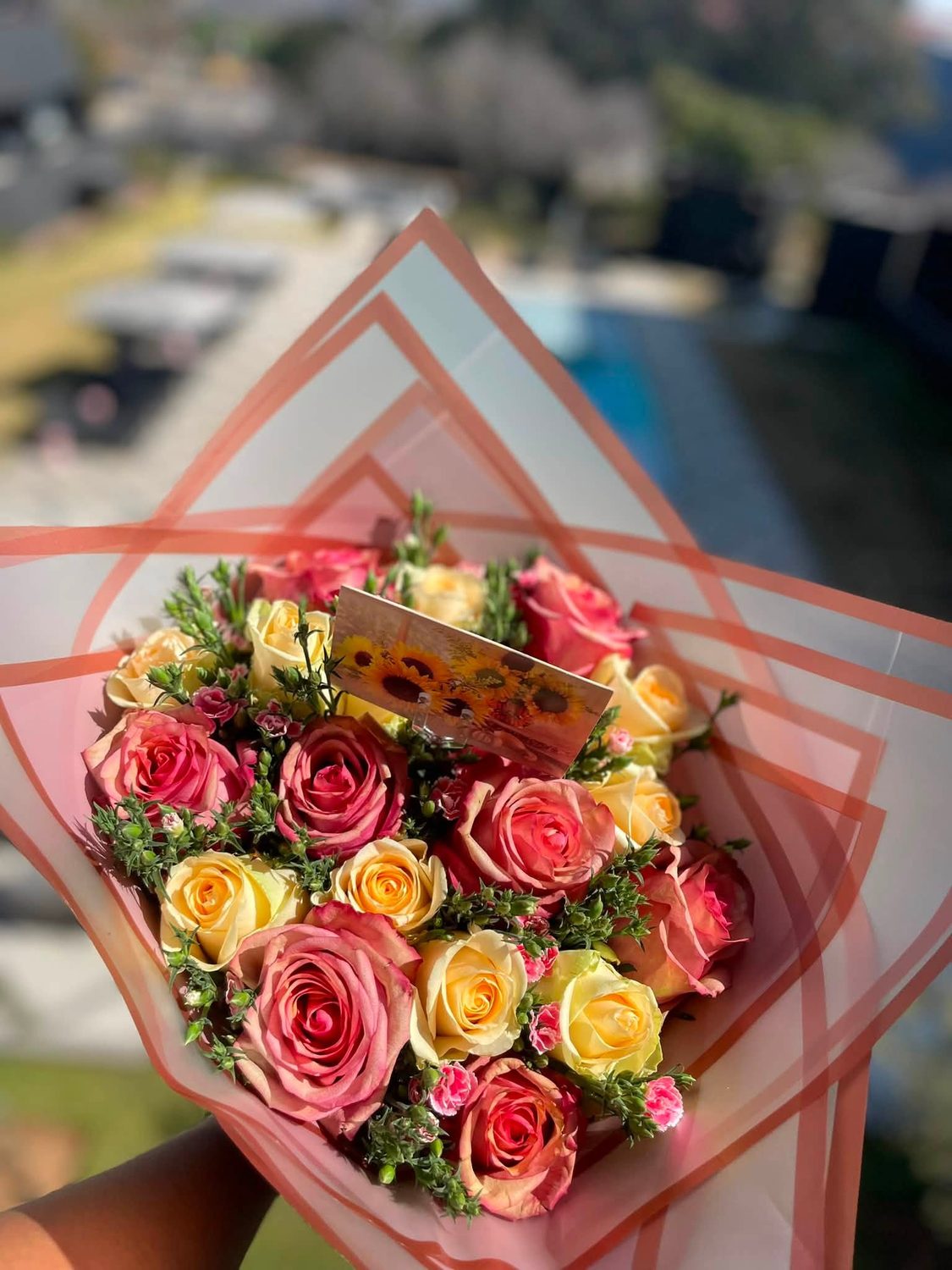 Hand-tied rose bouquet in blush and cream